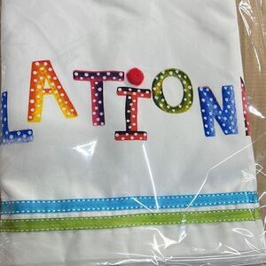 Congratulations table drape write on 28” x 80” never opened colorful print on wh